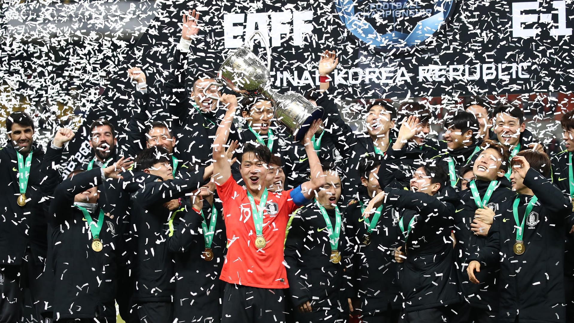 Captain Kim Younggwon of Korea Republic lifts the EAFF Football Championship trophy